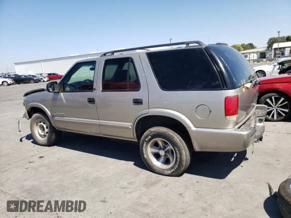 2002 Chevrolet Blazer LS z VIN 1GNDT13W22K190722, wystawiony jako Copart lot #68576164 z przebiegiem 124 420 mil mil oraz Szkoda całkowita • Salvage title. Historia ofert i sprzedaży dostępna na DreamBid. Obrazek 2.