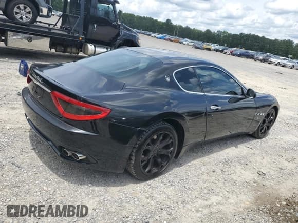 ✅ 2009 Maserati GranTurismo • VIN: ZAMGJ45A990047377 • Lot: 60991755. Listed on Copart with 95,562 mi. Free auction sales archive from the USA and detailed vehicle history report at DreamBid. Image 3.