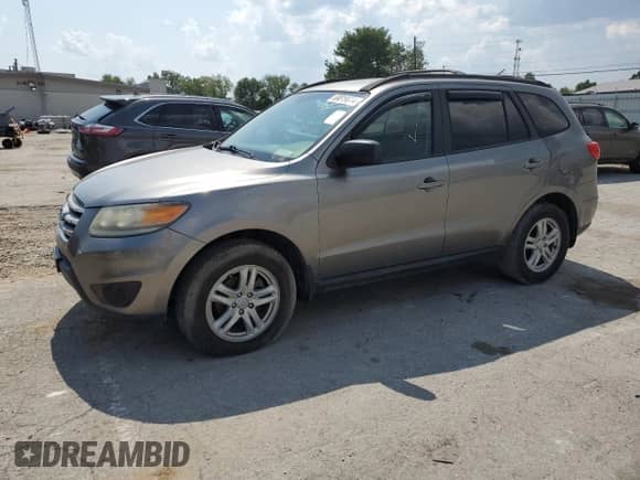 2012 Hyundai Santa Fe GLS z VIN 5XYZGDAB9CG114426, wystawiony jako Copart lot #69819974 z przebiegiem 233 854 mil mil oraz Czysty tytuł • Clean title. Historia ofert i sprzedaży dostępna na DreamBid. Obrazek 1.