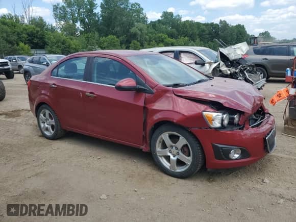 2012 Chevrolet Sonic LTZ with VIN 1G1JE5SH5C4152268, listed as a Copart auction lot 61047295 with 137,502 mi miles and Salvage title. Bid and sale history available at DreamBid. Image 4.