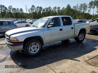 2002 Dodge Dakota Sport с VIN 1B7HL38N32S503296, выставлен на аукционе Copart как лот 75428444 с пробегом 239 482 миль миль и Списание • Salvage title. История ставок и продаж доступна на DreamBid. Изображение 1.