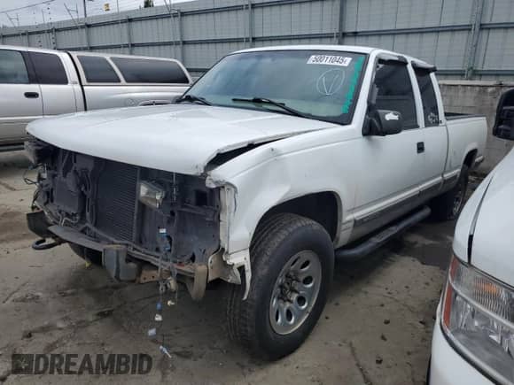 1999 Chevrolet Silverado 1500 with VIN 1GCEK19R2XR116510, listed as a Copart auction lot 50011045 with 174,401 mi miles and Salvage title. Bid and sale history available at DreamBid. Image 1.