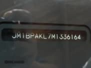 ✅ 2021 Mazda 3 Select • VIN: JM1BPAKL7M1336164 • Лот: 84984585. Опубликован ранее на Copart с пробегом Не указан. Бесплатный доступ к архиву аукционных продаж из США и подробный отчёт об истории автомобиля на DreamBid. Изображение 10.