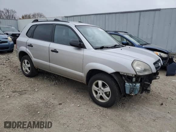 2005 Hyundai Tucson GL z VIN KM8JM12B75U146582, wystawiony jako Copart lot #82966094 z przebiegiem 132 445 mil mil oraz Nie do naprawy • Non repairable. Historia ofert i sprzedaży dostępna na DreamBid. Obrazek 4.