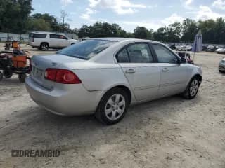 ✅ 2006 Kia Optima LX • VIN: KNAGE123X65063709 • Лот: 75927094. Опубликован ранее на Copart с пробегом 101 893 миль. Бесплатный доступ к архиву аукционных продаж из США и подробный отчёт об истории автомобиля на DreamBid. Изображение 3.