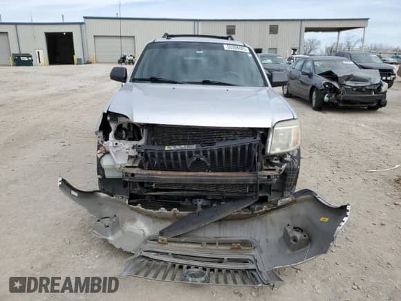 2011 Mercury Mariner z VIN 4M2CN8B73BKJ06886, wystawiony jako Copart lot #50308485 z przebiegiem 118 584 mil mil oraz Szkoda całkowita • Salvage title. Historia ofert i sprzedaży dostępna na DreamBid. Obrazek 5.