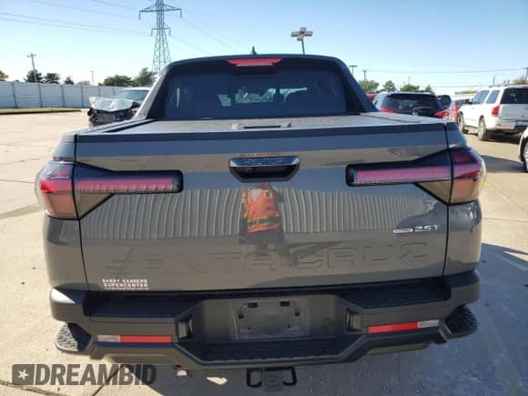 2023 Hyundai Santa Cruz Night Edition z VIN 5NTJCDAF7PH043433, wystawiony jako Copart lot #79845124 z przebiegiem Nie podano mil oraz Szkoda całkowita • Salvage title. Historia ofert i sprzedaży dostępna na DreamBid. Obrazek 6.