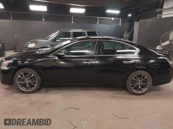 2012 Nissan Maxima S z VIN 1N4AA5AP9CC863172, wystawiony jako IAAI lot #42120073 z przebiegiem 102 500 mil mil oraz . Historia ofert i sprzedaży dostępna na DreamBid. Obrazek 14.