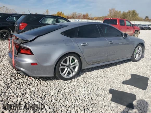 ✅ 2016 Audi S7 • VIN: WAUW2AFC5GN105817 • Lot: 76579934. Listed on Copart with 112,894 mi. Free auction sales archive from the USA and detailed vehicle history report at DreamBid. Image 3.