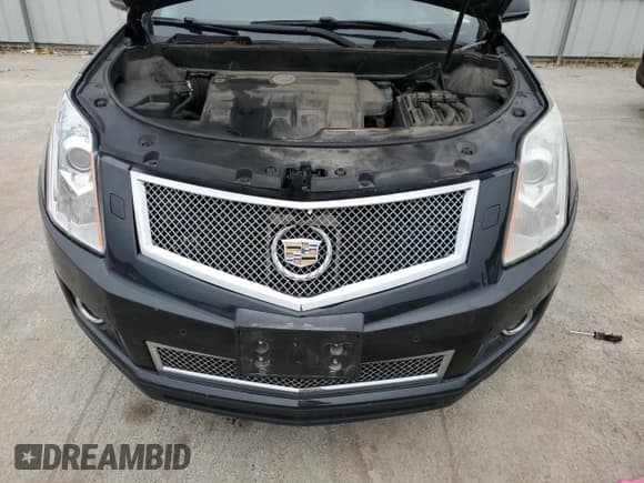 ✅ 2013 Cadillac SRX Premium Collection • VIN: 3GYFNEE38DS584197 • Lot: 71717245. Wystawiony na Copart z przebiegiem 118 361 mil. Bezpłatny archiwum sprzedaży aukcyjnych z USA i szczegółowy raport historii pojazdu na DreamBid. Zdjęcie 12.