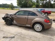 ✅ 2014 Volkswagen Beetle 1.8T • VIN: 3VWJ07AT0EM662491 • Lot: 55875594. Listed on Copart with Not provided. Free auction sales archive from the USA and detailed vehicle history report at DreamBid. Image 2.