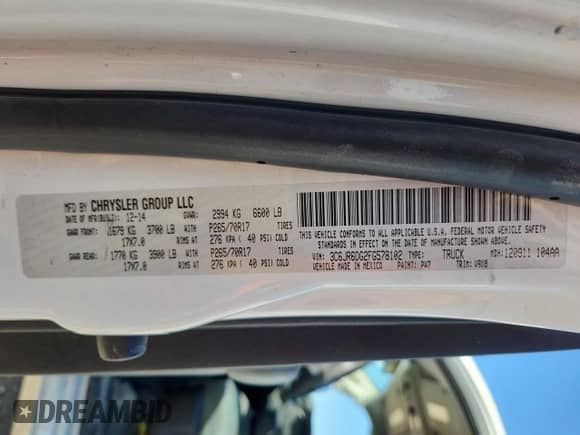 2015 Ram 1500 Tradesman with VIN 3C6JR6DG2FG578102, listed as a Copart auction lot 82678215 with 259,090 mi miles and Salvage title. Bid and sale history available at DreamBid. Image 12.