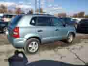2005 Hyundai Tucson GL z VIN KM8JM12B55U119266, wystawiony jako Copart lot #79095984 z przebiegiem 114 939 mil mil oraz Szkoda całkowita • Salvage title. Historia ofert i sprzedaży dostępna na DreamBid. Obrazek 3.