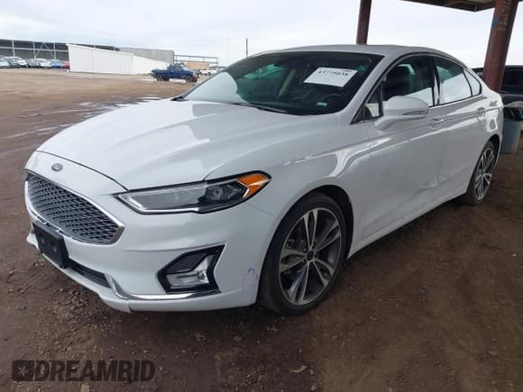 ✅ 2020 Ford Fusion Titanium • VIN: 3FA6P0D97LR191845 • Lot: 43775038. Wystawiony na IAAI z przebiegiem 98 931 mil. Bezpłatny archiwum sprzedaży aukcyjnych z USA i szczegółowy raport historii pojazdu na DreamBid. Zdjęcie 2.