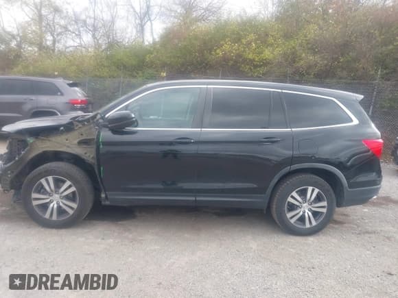 ✅ 2017 Honda Pilot EX-L • VIN: 5FNYF6H55HB062267 • Lot: 43680104. Listed on IAAI with 119,797 mi. Free auction sales archive from the USA and detailed vehicle history report at DreamBid. Image 15.