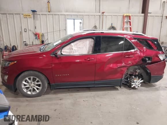 2018 Chevrolet Equinox LT z VIN 2GNAXSEVXJ6112062, wystawiony jako IAAI lot #43406177 z przebiegiem 69 608 mil mil oraz . Historia ofert i sprzedaży dostępna na DreamBid. Obrazek 13.