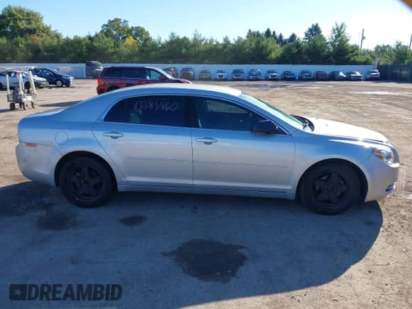 2012 Chevrolet Malibu 1LS with VIN 1G1ZB5E05CF240002, listed as a IAAI auction lot 43385460 with 151,059 mi miles and . Bid and sale history available at DreamBid. Image 13.