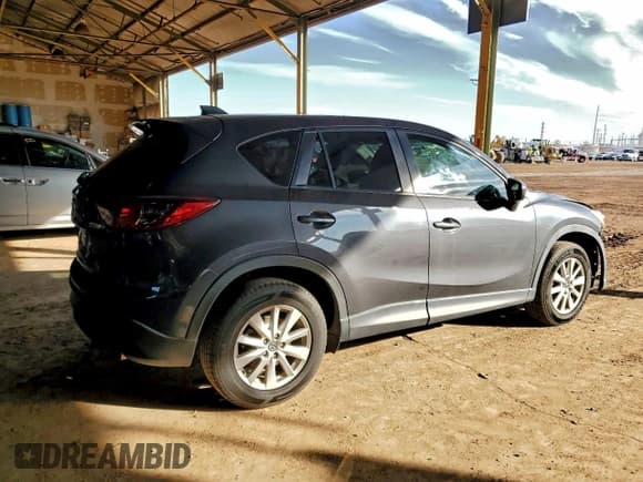 ✅ 2015 Mazda CX-5 Touring • VIN: JM3KE2CY1F0488124 • Лот: 94554135. Опубликован ранее на Copart с пробегом 102 833 миль. Бесплатный доступ к архиву аукционных продаж из США и подробный отчёт об истории автомобиля на DreamBid. Изображение 3.