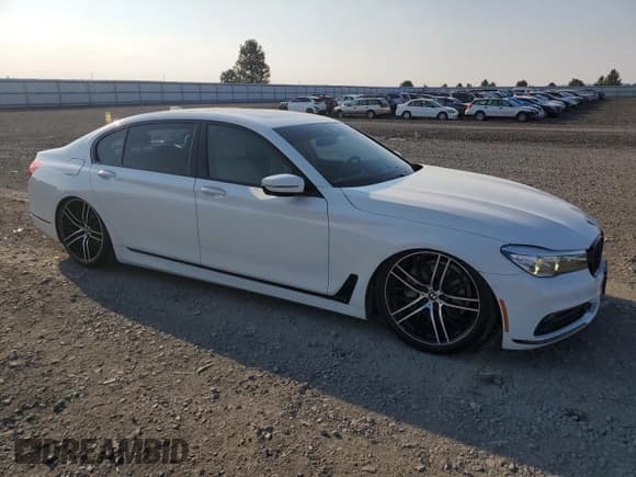 ✅ 2016 BMW 7 Series 740i • VIN: WBA7E2C52GG547305 • Лот: 80148255. Опубликован ранее на Copart с пробегом 99 952 миль. Бесплатный доступ к архиву аукционных продаж из США и подробный отчёт об истории автомобиля на DreamBid. Изображение 4.