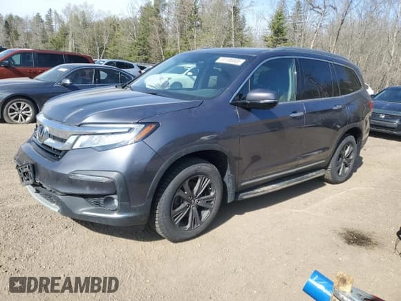 ✅ 2022 Honda Pilot Touring 7-Passenger • VIN: 5FNYF6H61NB504935 • Lot: 51186805. Listed on Copart with 99,373 mi. Free auction sales archive from the USA and detailed vehicle history report at DreamBid. Image 1.