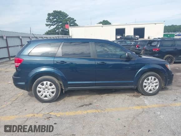 2015 Dodge Journey American Value z VIN 3C4PDCABXFT610861, wystawiony jako IAAI lot #43068421 z przebiegiem 153 937 mil mil oraz . Historia ofert i sprzedaży dostępna na DreamBid. Obrazek 13.