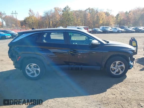 ✅ 2022 Hyundai Tucson SE • VIN: 5NMJACAE0NH053009 • Lot: 43550808. Listed on IAAI with 48,601 mi. Free auction sales archive from the USA and detailed vehicle history report at DreamBid. Image 14.