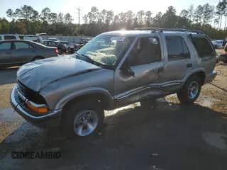 2001 Chevrolet Blazer LS z VIN 1GNCS13W71K244416, wystawiony jako Copart lot #77312694 z przebiegiem 194 740 mil mil oraz Szkoda całkowita • Salvage title. Historia ofert i sprzedaży dostępna na DreamBid. Obrazek 1.