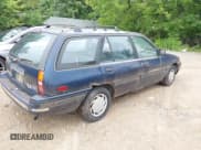 ✅ 1993 Ford Escort LX • VIN: 1FAPP15J3PW315972 • Lot: 42553063. Listed on IAAI with 86,374 mi. Free auction sales archive from the USA and detailed vehicle history report at DreamBid. Image 4.