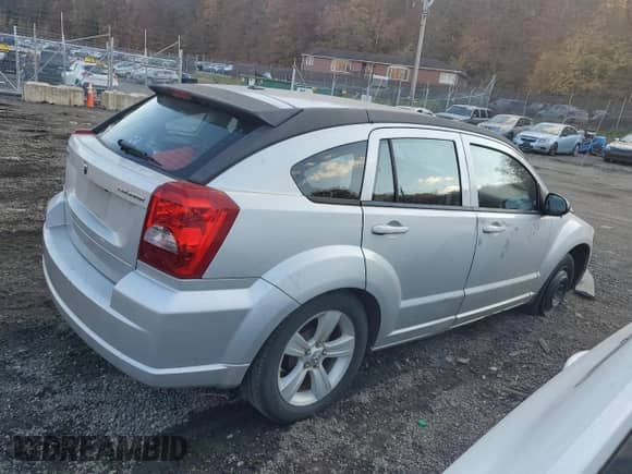 2011 Dodge Caliber Mainstreet with VIN 1B3CB3HA3BD123701, listed as a Copart auction lot 90858485 with 172,631 mi miles and Salvage title. Bid and sale history available at DreamBid. Image 3.