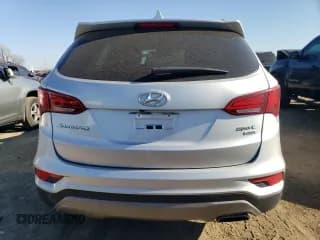 ✅ 2018 Hyundai Santa Fe 2.4L • VIN: 5XYZUDLB9JG505921 • Лот: 76648243. Опубликован ранее на Copart с пробегом 65 623 миль. Бесплатный доступ к архиву аукционных продаж из США и подробный отчёт об истории автомобиля на DreamBid. Изображение 6.