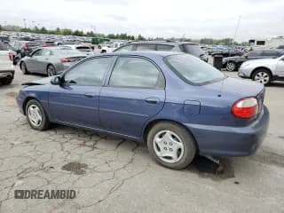 ✅ 2001 Kia Sephia • VIN: KNAFB121215071394 • Lot: 81778665. Listed on Copart with 42,134 mi. Free auction sales archive from the USA and detailed vehicle history report at DreamBid. Image 2.