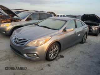 2012 Hyundai Azera z VIN KMHFG4JG2CA150100, wystawiony jako Copart lot #76564884 z przebiegiem Nie podano mil oraz Szkoda całkowita • Salvage title. Historia ofert i sprzedaży dostępna na DreamBid. Obrazek 1.