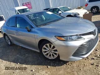 ✅ 2019 Toyota Camry LE • VIN: 4T1B11HK9KU852100 • Lot: 43581436. Listed on IAAI with 214,763 mi. Free auction sales archive from the USA and detailed vehicle history report at DreamBid. Image 1.