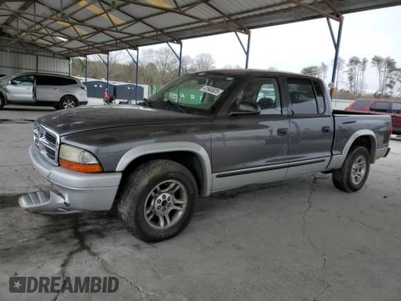 2002 Dodge Dakota SLT z VIN 1B7HL48X32S708723, wystawiony jako Copart lot #41940825 z przebiegiem 112 145 mil mil oraz Szkoda całkowita • Salvage title. Historia ofert i sprzedaży dostępna na DreamBid. Obrazek 1.
