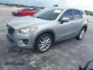 ✅ 2015 Mazda CX-5 Grand Touring • VIN: JM3KE2DY7F0506754 • Lot: 42941376. Wystawiony na IAAI z przebiegiem 143 762 mil. Bezpłatny archiwum sprzedaży aukcyjnych z USA i szczegółowy raport historii pojazdu na DreamBid. Zdjęcie 2.