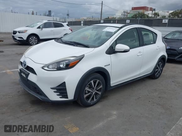 ✅ 2018 Toyota Prius One • VIN: JTDKDTB37J1615520 • Lot: 42054113. Listed on IAAI with 76,989 mi. Free auction sales archive from the USA and detailed vehicle history report at DreamBid. Image 2.