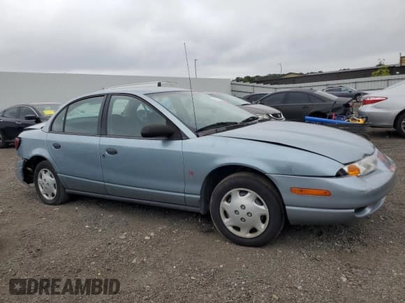✅ 2002 Saturn SL • VIN: 1G8ZH528X2Z169290 • Lot: 68372645. Listed on Copart with 72,983 mi. Free auction sales archive from the USA and detailed vehicle history report at DreamBid. Image 4.