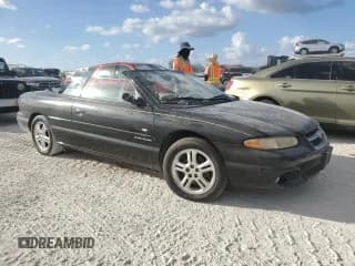 ✅ 1997 Chrysler Sebring JXi • VIN: 3C3EL55H0VT600900 • Lot: 77369964. Listed on Copart with Not provided. Free auction sales archive from the USA and detailed vehicle history report at DreamBid. Image 4.