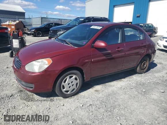 2006 Hyundai Accent GL z VIN KMHCN45C26U052459, wystawiony jako Copart lot #84417075 z przebiegiem 247 312 mil mil oraz Szkoda całkowita • Salvage title. Historia ofert i sprzedaży dostępna na DreamBid. Obrazek 1.