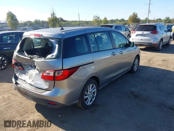 ✅ 2012 Mazda 5 Sport • VIN: JM1CW2BL3C0140935 • Lot: 43357001. Listed on IAAI with 105,389 mi. Free auction sales archive from the USA and detailed vehicle history report at DreamBid. Image 4.