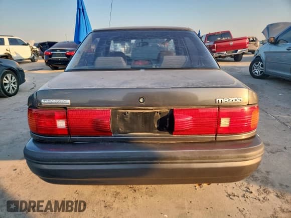 ✅ 1994 Mazda Protege • VIN: JM1BG2265R0782553 • Lot: 69733705. Listed on Copart with 332,290 mi. Free auction sales archive from the USA and detailed vehicle history report at DreamBid. Image 6.