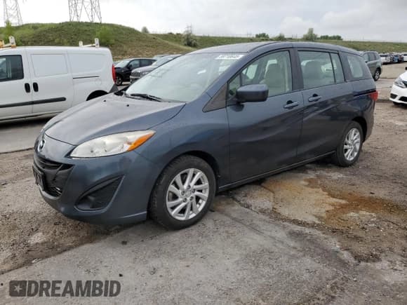 ✅ 2012 Mazda 5 Sport • VIN: JM1CW2BL3C0112195 • Lot: 59710645. Listed on Copart with 111,574 mi. Free auction sales archive from the USA and detailed vehicle history report at DreamBid. Image 1.