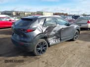 ✅ 2021 Mazda CX-30 Premium • VIN: 3MVDMBDYXMM263289 • Lot: 43580728. Listed on IAAI with 29,453 mi. Free auction sales archive from the USA and detailed vehicle history report at DreamBid. Image 4.