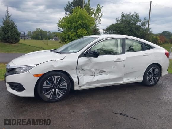 ✅ 2018 Honda Civic EX-T • VIN: JHMFC1F3XJX002306 • Lot: 43149201. Listed on IAAI with 77,470 mi. Free auction sales archive from the USA and detailed vehicle history report at DreamBid. Image 6.