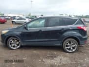 ✅ 2015 Ford Escape Titanium • VIN: 1FMCU9J94FUC39311 • Lot: 42542693. Listed on IAAI with 129,747 mi. Free auction sales archive from the USA and detailed vehicle history report at DreamBid. Image 14.