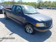 ✅ 2003 Ford F-150 XL • VIN: 1FTRX17W03NB84642 • Lot: 42141979. Listed on IAAI with 112,902 mi. Free auction sales archive from the USA and detailed vehicle history report at DreamBid. Image 1.