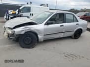 ✅ 2001 Mazda Protege DX • VIN: JM1BJ222310425181 • Lot: 88560255. Wystawiony na Copart z przebiegiem 201 942 mil. Bezpłatny archiwum sprzedaży aukcyjnych z USA i szczegółowy raport historii pojazdu na DreamBid. Zdjęcie 1.
