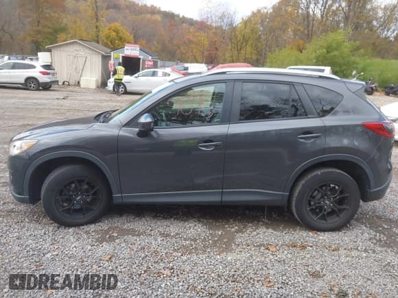 ✅ 2015 Mazda CX-5 Grand Touring • VIN: JM3KE4DY8F0461450 • Lot: 43599095. Listed on IAAI with 137,866 mi. Free auction sales archive from the USA and detailed vehicle history report at DreamBid. Image 14.