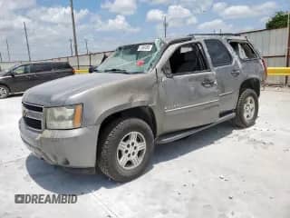 2007 Chevrolet Tahoe LS with VIN 1GNFC13C07J340290, listed as a Copart auction lot 61860395 with 207,574 mi miles and Salvage title. Bid and sale history available at DreamBid. Image 1.