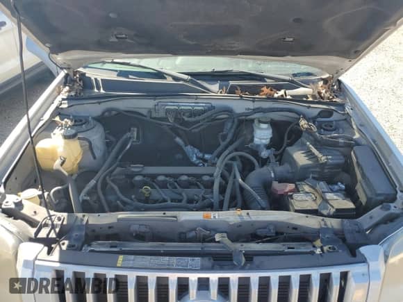 2011 Mercury Mariner z VIN 4M2CN8B77BKJ05126, wystawiony jako Copart lot #48365395 z przebiegiem 179 768 mil mil oraz Szkoda całkowita • Salvage title. Historia ofert i sprzedaży dostępna na DreamBid. Obrazek 11.